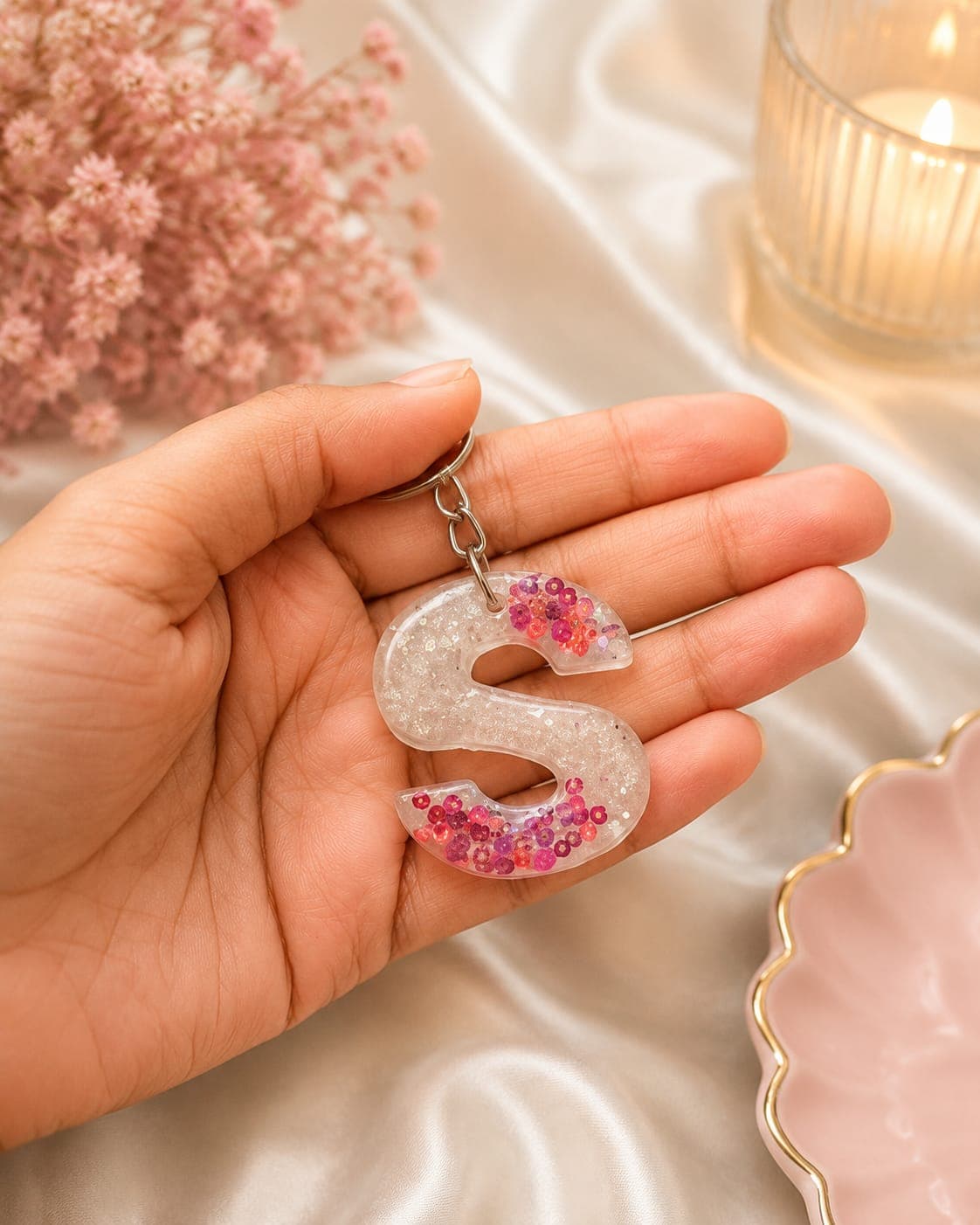 Clear resin S keychain with pink confetti